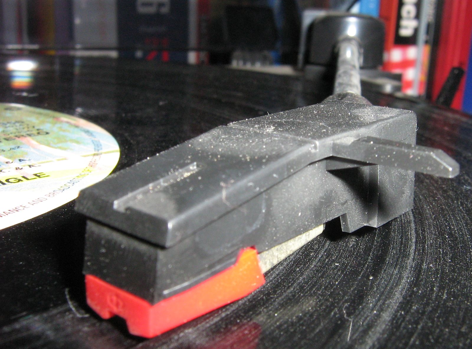 A visibly dusty record playing on a turntable