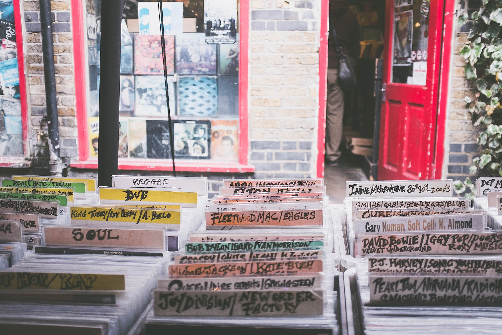 Vinyl records arranged by section in a record store