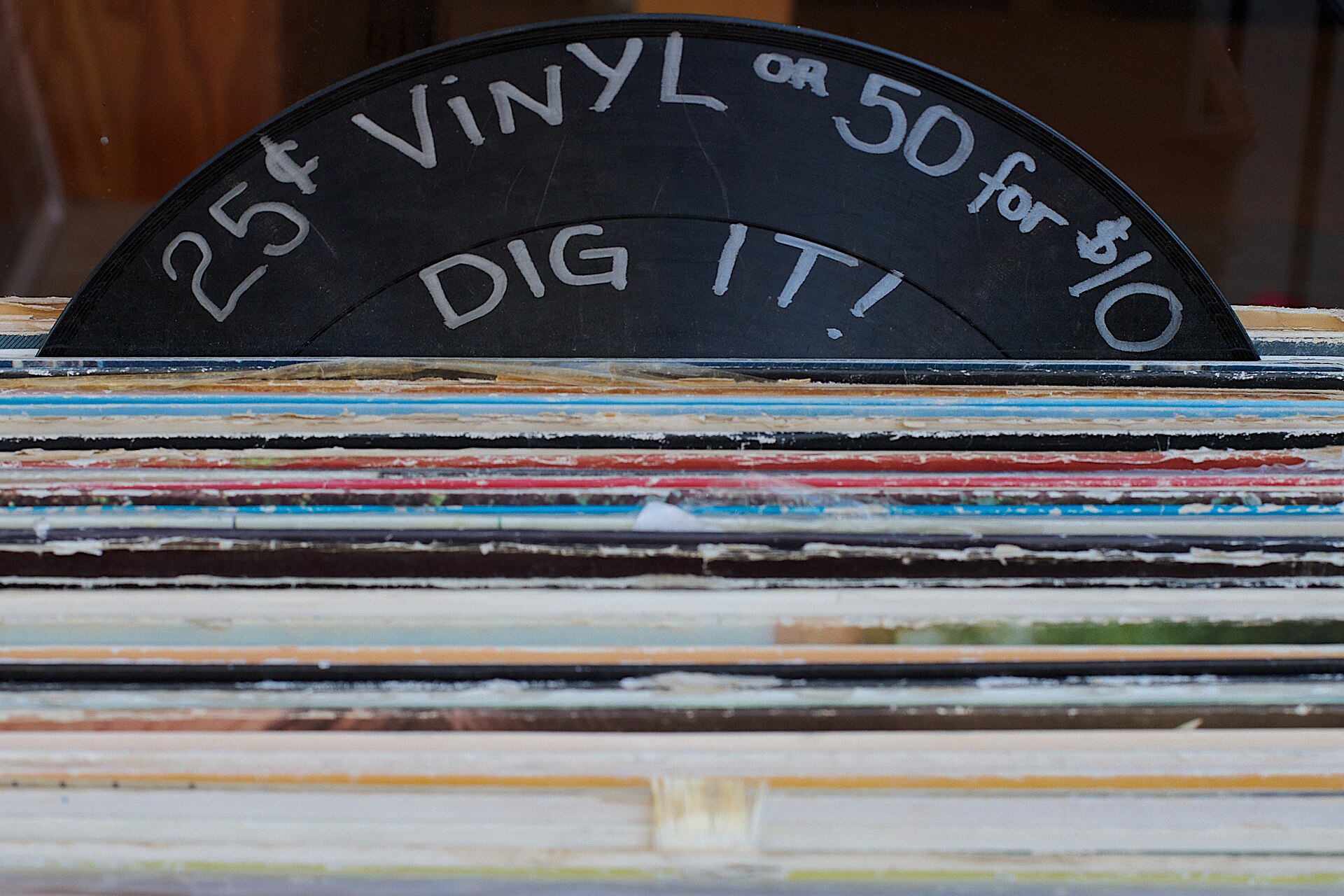 A crate of low-priced records at a flea market