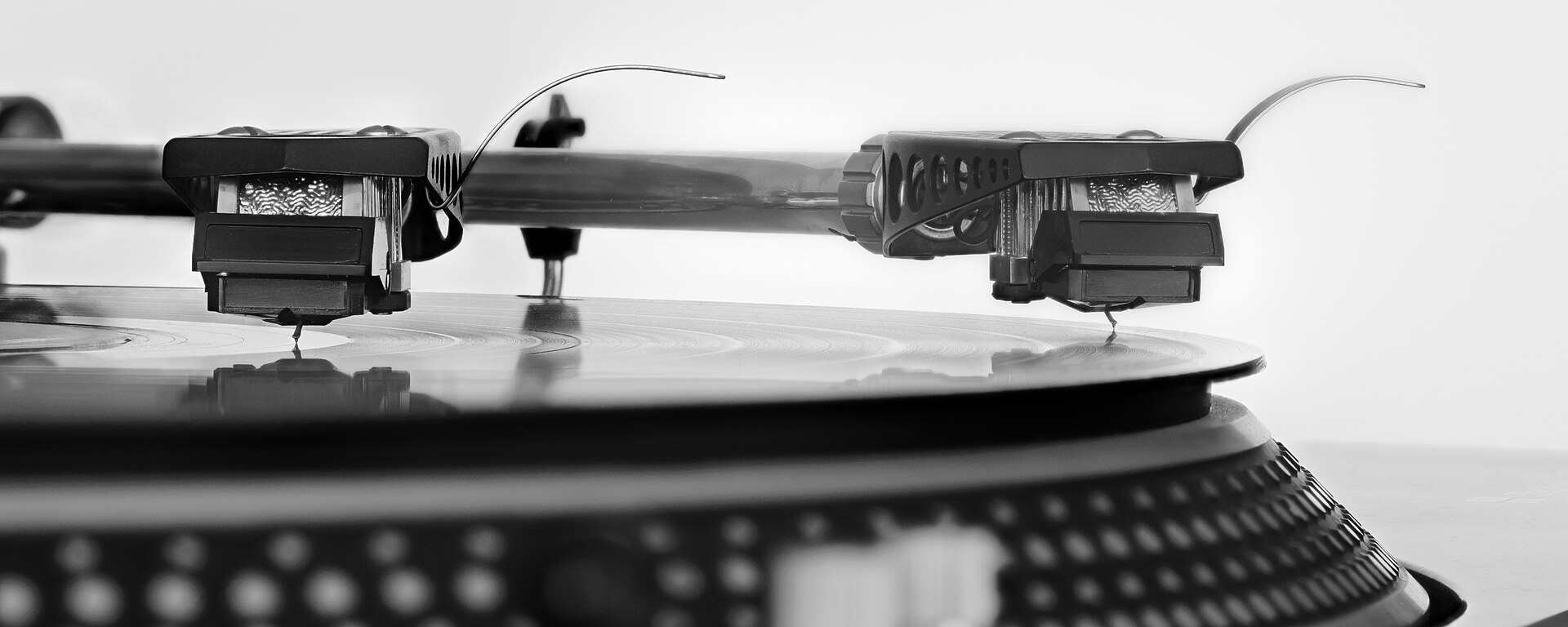 Macro photo of a stylus tracking in a record groove