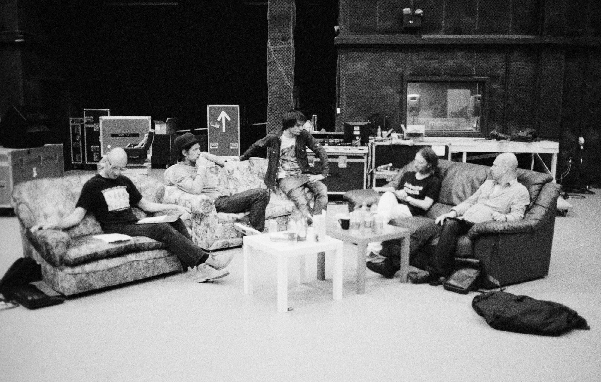 Radiohead members resting indoors, photographed by Colin Greenwood