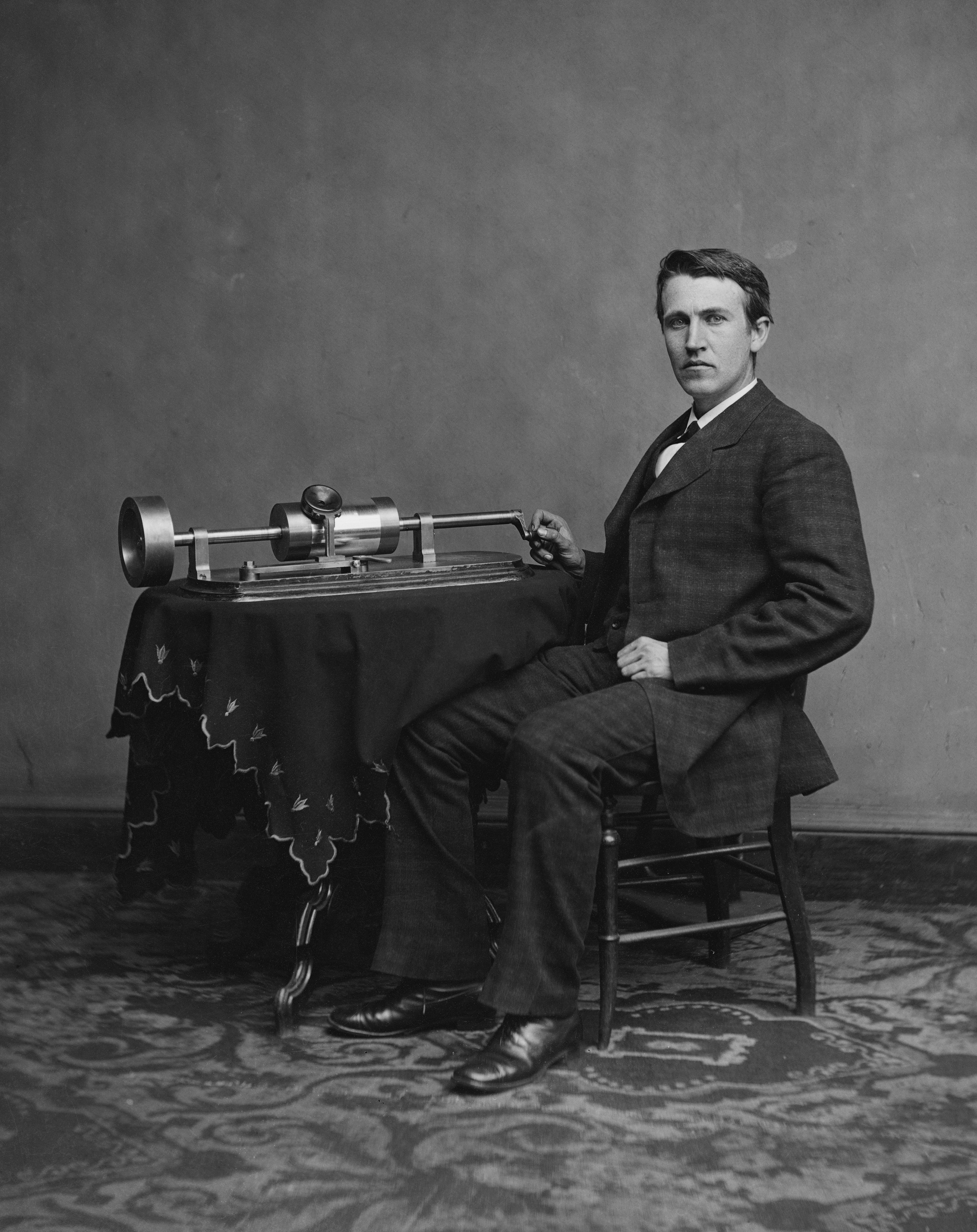 Edison with an early cylinder phonograph, circa 1877–1878. Original photograph held by the Library of Congress.